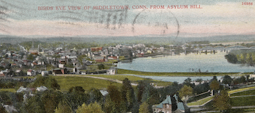 A color-tinted vintage postcard featuring a bird's-eye panoramic view of Middletown, Connecticut, from Asylum Hill, showing the town layout alongside the Connecticut River.