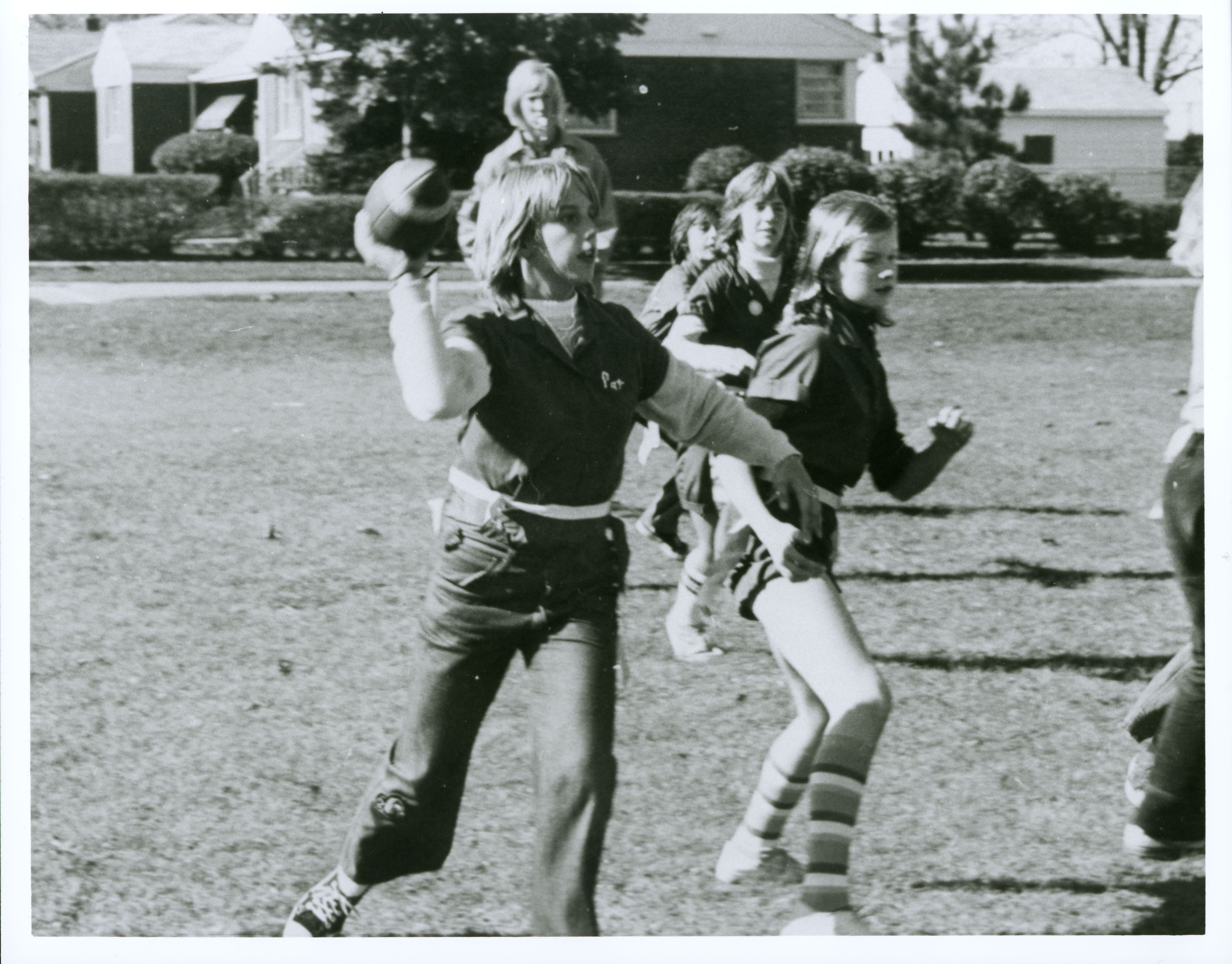 Girls playing football.