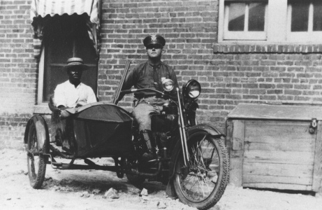Motorcycle Policeman with sidecar occupied.
