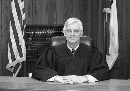 Portrait of James T. Hill in his judge's robes.