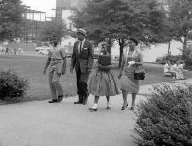 African-American family walking into school.