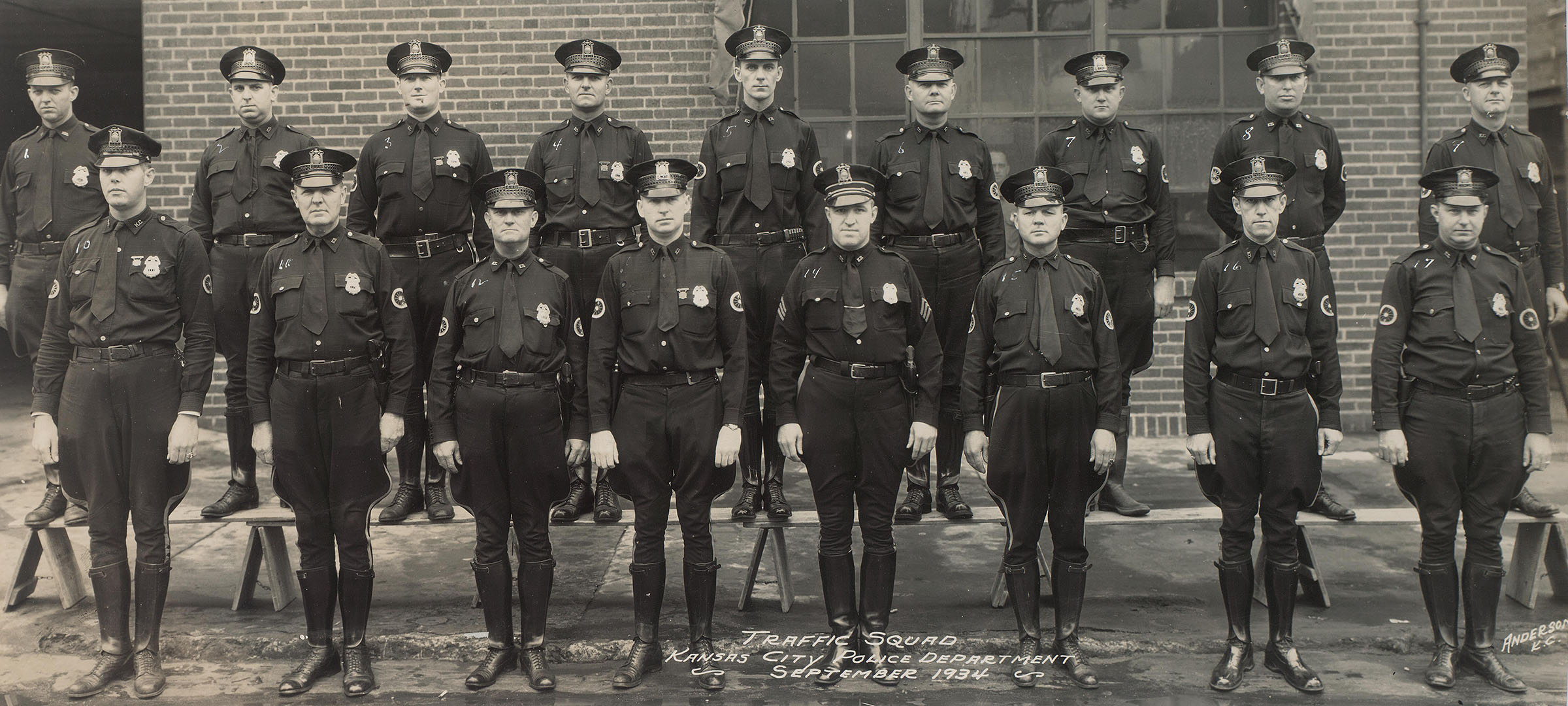 A group of police officers posed in two rows.
