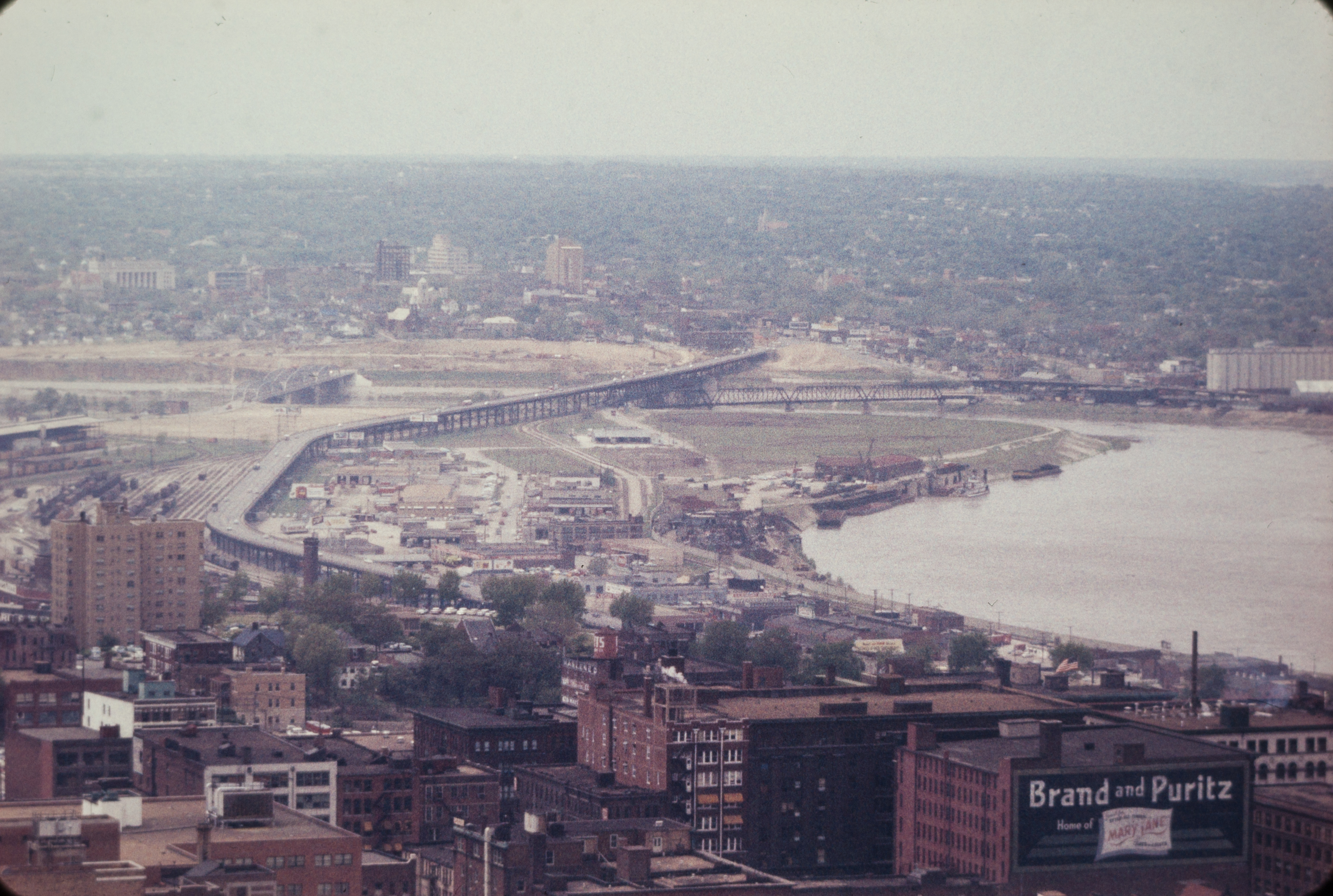 Aerial view of a downtown area with a river visible at right.