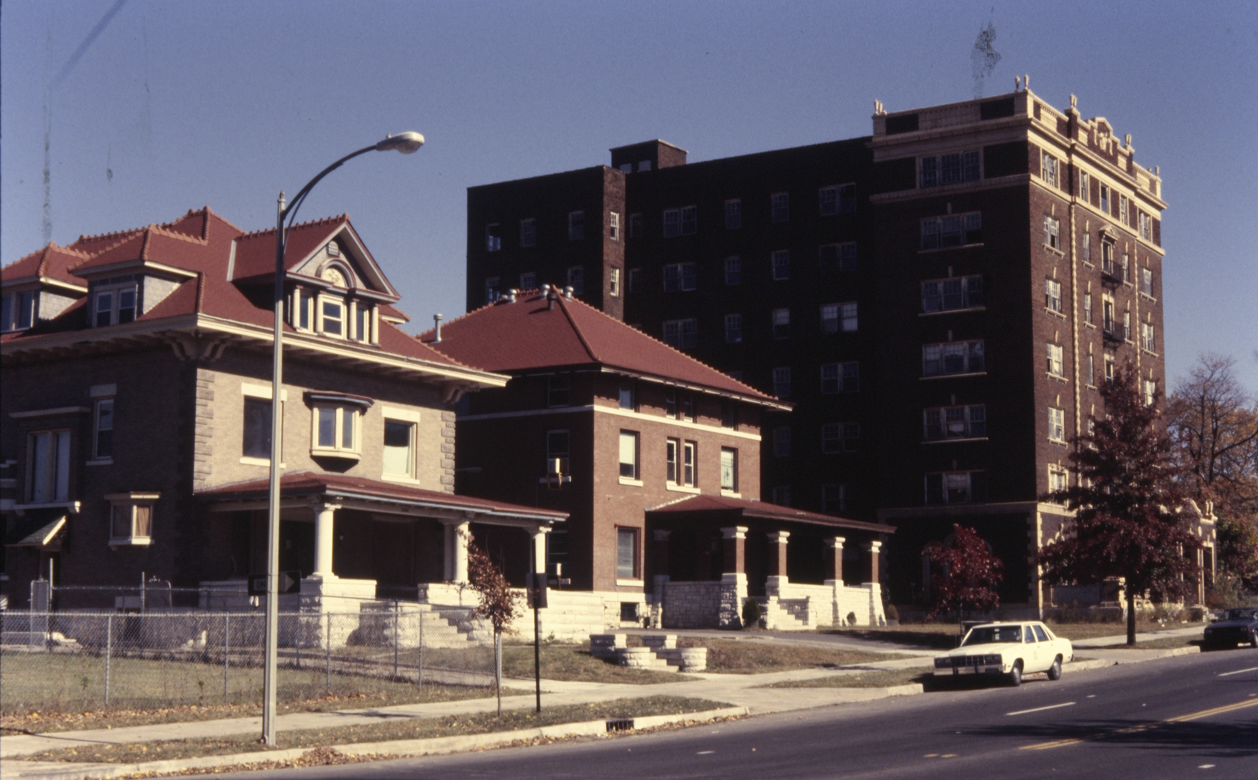 Two houses and an apartment building.