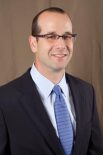 Photographic headshot of John Feigenbaum.