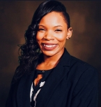 Photographic headshot of Kim Dumas.