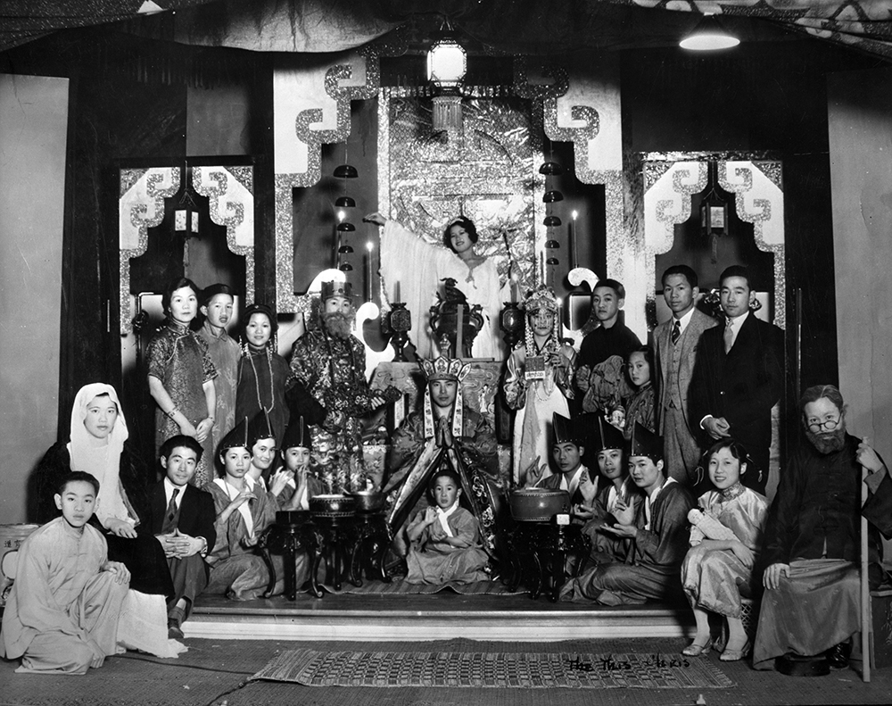 A black-and-white image of Chinese individuals dressed in Biblical and traditional Chinese costumes posing on a stage.
