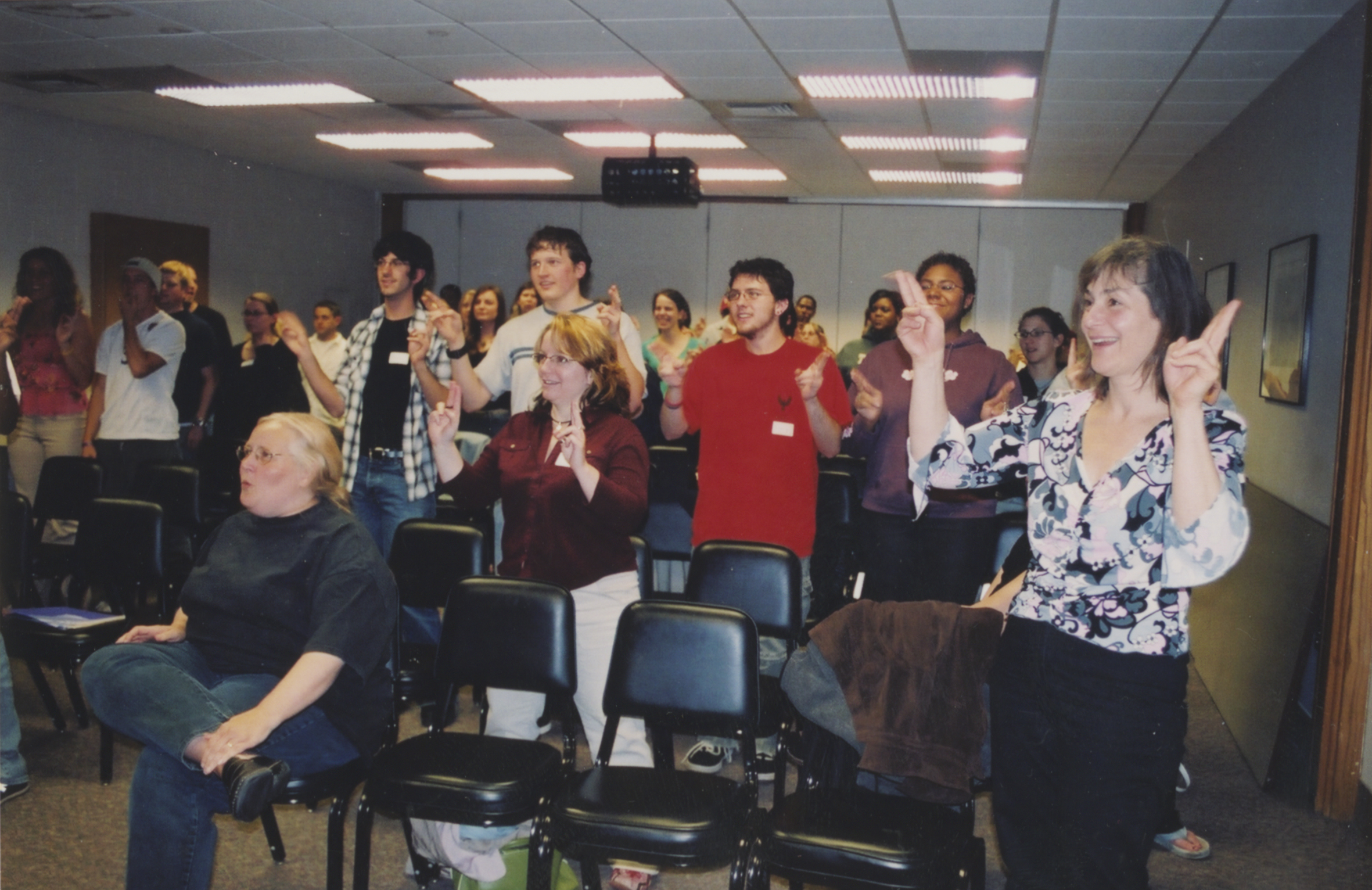 Photograph of a group of people signing
