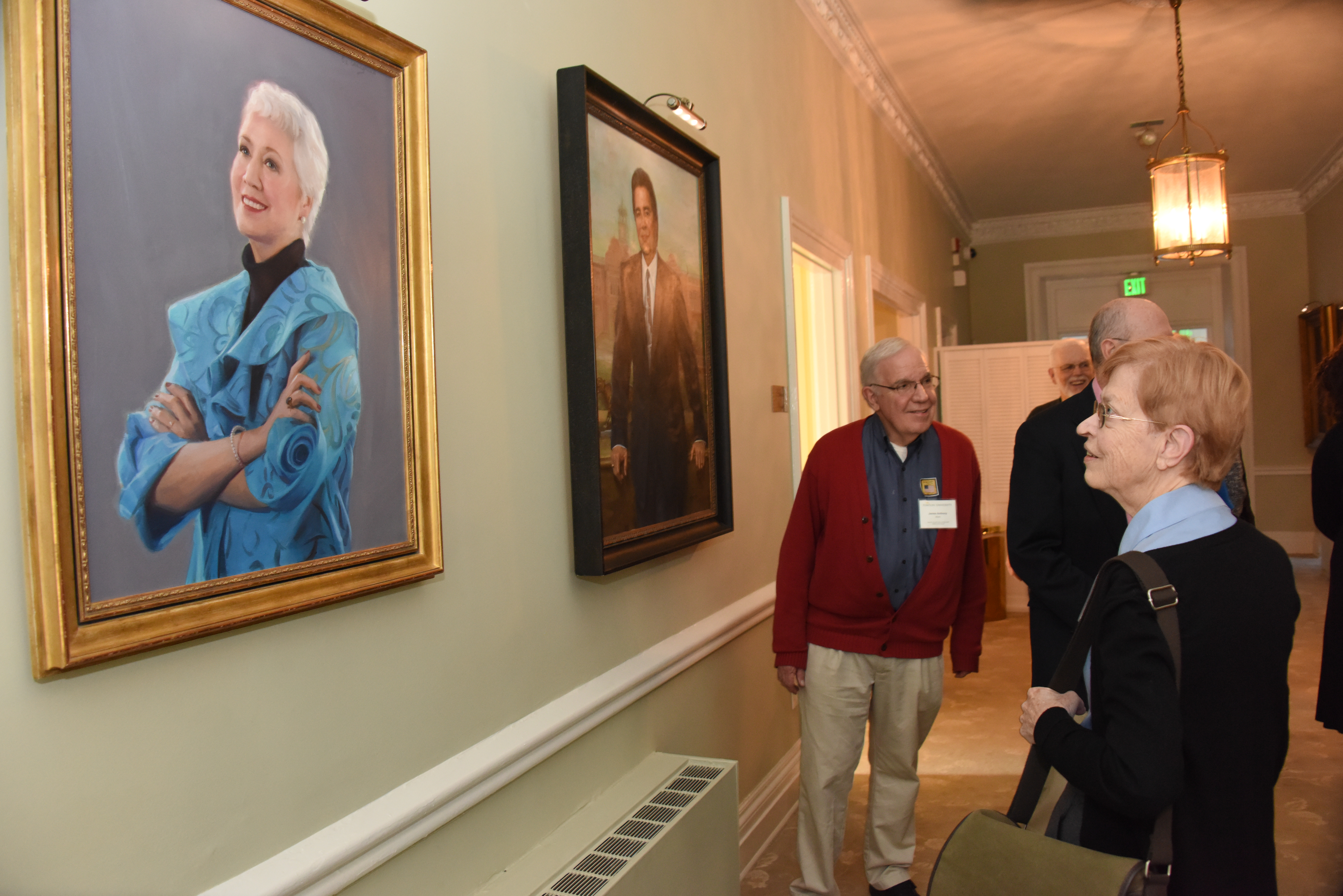 TURA members looking at portraits of former presidents