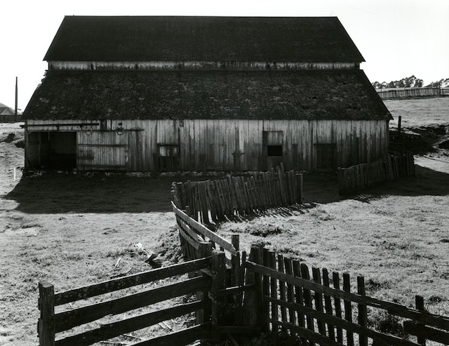 Historic barn building on campus, black & white