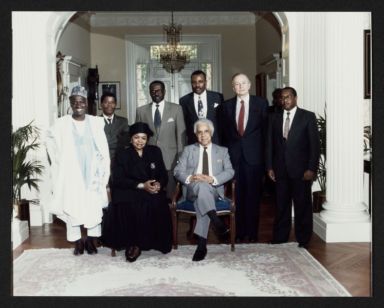L. Douglas Wilder seated surrounded by African leaders